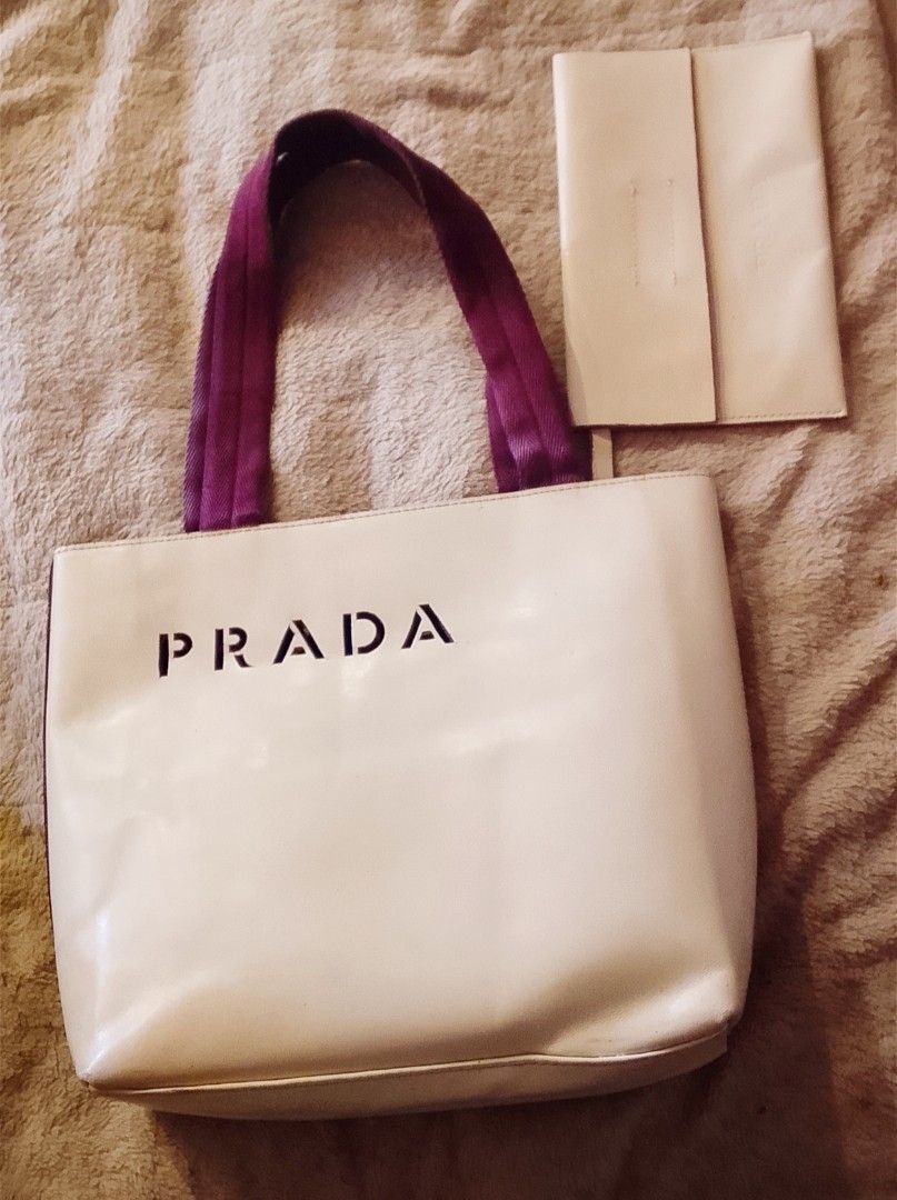 Preloved Prada Leather Shoulder Bag Tote Bag (Category: Luxury Bags & Wallets) located in Alicia. Submitted by celynahambotruecelyna39 (Listing ID 1405533302, Image 1). Description: - Authentic Prada shoulder bag - Beige exterior with burgundy straps - Includes a small matching pouch - Features the Prada logo - Medium-sized tote bag - Perfect for everyday use - Made in Japan.