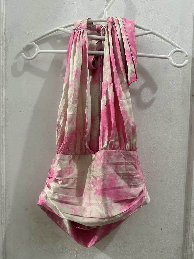 Privacy Please Pink Tie Dye Halter Top Size S (Category: Sleeveless) located in Quezon City. Submitted by shop.theclutter (Listing ID 1446178243, Image 2). Description: - Cute pink and white tie dye halter top - Brand: Privacy Please - Ruched detailing on bodice and sleeves - Ties at neck - Ideal for night outs or vacations.