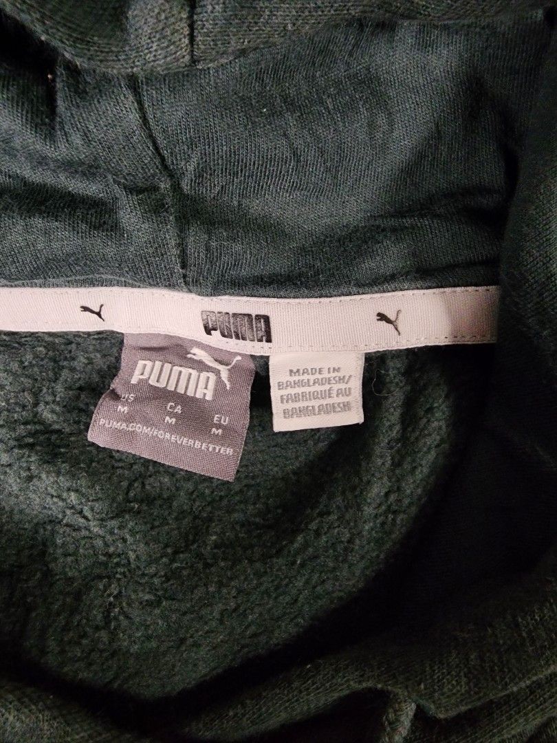 Puma Green Pullover Hoodie (Category: Coats, Jackets and Outerwear) located in La Trinidad. Submitted by closetloop2601 (Listing ID 1446300576, Image 3). Description: 350 + SF Size : Medium on tag W: 20.5 in | L: 23 in Issue: Minimal stain (see last pic) Good condition Color may vary due to lighting.