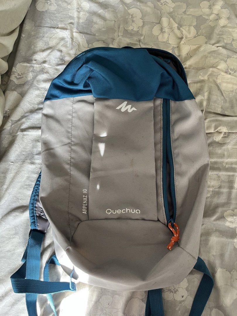 Quechua Arpenaz Hiking Backpack (Category: Backpacks) located in Makati City. Submitted by diannecheryl (Listing ID 1446247923, Image 1). Description: MOP: GCash Delivery: J&T or Lalamove - For hiking - Grey and teal Quechua Arpenaz 10 backpack - Front zip pocket with distinctive orange pull tab - Adjustable shoulder straps for a comfortable fit - Ideal for day trips or carrying your daily essentials.