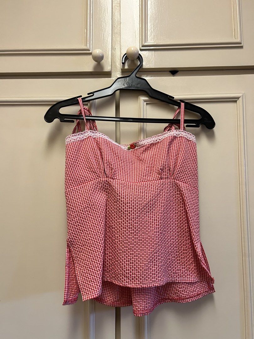 Red Gingham Tie Back Crop Top with Lace Trim (Category: Sleeveless) located in Muntinlupa City. Submitted by caradb (Listing ID 1446243314, Image 1). Description: - Adorable red gingham crop top - Sweetheart neckline with delicate lace trim - Adjustable tie straps for a perfect fit - Chic open back design with a large bow detail - Lightweight fabric, ideal for warm weather - Great for summer days, picnics, or a cute, casual look - Pairs perfectly