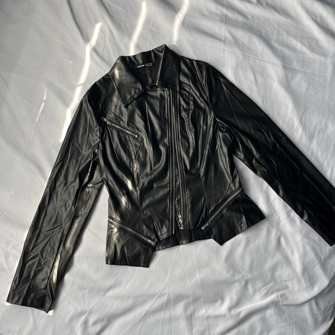 SHEIN Black Faux Leather Biker Jacket (Category: Coats, Jackets and Outerwear) located in Manila. Submitted by marybelle.mb (Listing ID 1446257017, Image 3). Description: - Black faux leather biker jacket from SHEIN - Asymmetrical zip front - Multiple zip pockets - Pointed collar - Long sleeves with zip cuffs - Cropped hemline - Ideal for layering.