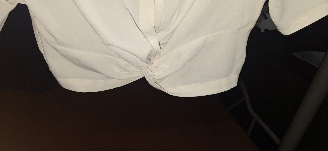 SHEIN White Cropped Twist Front Shirt (Category: Others Tops) located in Manila. Submitted by julie_pc (Listing ID 1446316529, Image 2). Description: Pre Loved SHEIN white cropped shirt, size L (fits like). Features a twist front hem, short sleeves, and collar. Perfect for casual or dressed-up looks..