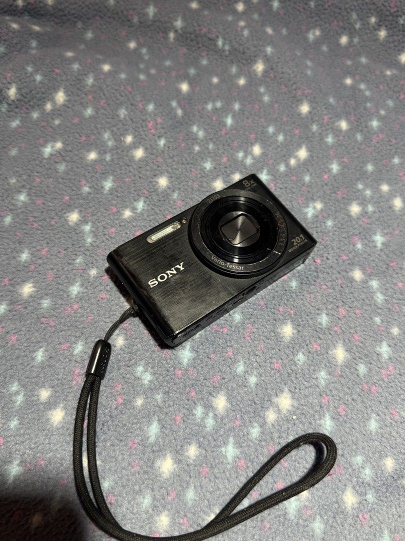 Sony Cyber-shot 8x Optical Zoom Digital Camera (Category: Cameras) located in Quezon City. Submitted by ncstbr367 (Listing ID 1446317358, Image 1). Description: 📸 Sony Cyber-shot Digital Camera (Black) ✨ Features: 20.1 MP for clear and sharp photos 8x Optical Zoom Sleek black color Comes with wrist strap Tested and working Great for everyday use, travel, and casual photography ⚠️ Please read before buying (Issues): Previously repaired Video reco