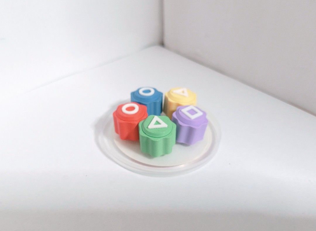 Squid Game Accessories set (Category: Figurines & Statues) located in Manila. Submitted by gcv237. (Listing ID 1446339168, Image 2). Description: Sauid Game Accessories Set! ⏺️🔼⏹️ ☂️🔑 Set includes: 3 Style Custom-made Ddakji (딱지) Condition: 9/10 (minimum creases ) 3D Printed Hide & Seek key Condition: 8/10 (detaching from the base) 3D Printed Gonggi (공기) Condition: 10/10 (Not played with, only stored) Jegichagi (제기차기) Condition: 9.5/10 (Not pla
