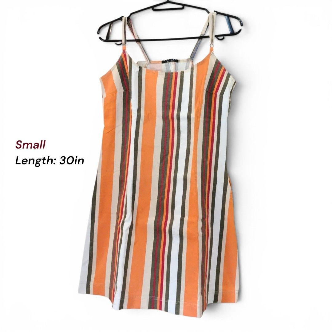 Striped Mini Dress - Orange, White, Brown, Red (Category: Dresses) located in Pagbilao. Submitted by polenggay09 (Listing ID 1446206429, Image 1). Description: - Cute mini dress - Vertical stripe pattern (orange, white, brown, red) - Spaghetti straps - Simple silhouette - Length: 30 inches - Size: Small - Ideal for casual wear or a night out.