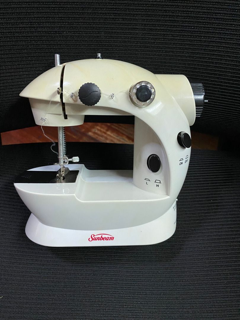 Sunbeam Mini Sewing Machine (Category: Other Home Appliances) located in Manila. Submitted by missberns (Listing ID 1446261716, Image 2). Description: - Compact Sunbeam sewing machine - Ideal for small projects and minor repairs - Includes foot pedal - Comes with a bag of bobbins - Easy to use with on/off switch - Adjustable speed settings (Low/High) - Great for beginners or for keeping handy - Power adaptor not included but can work with 4 AA ba