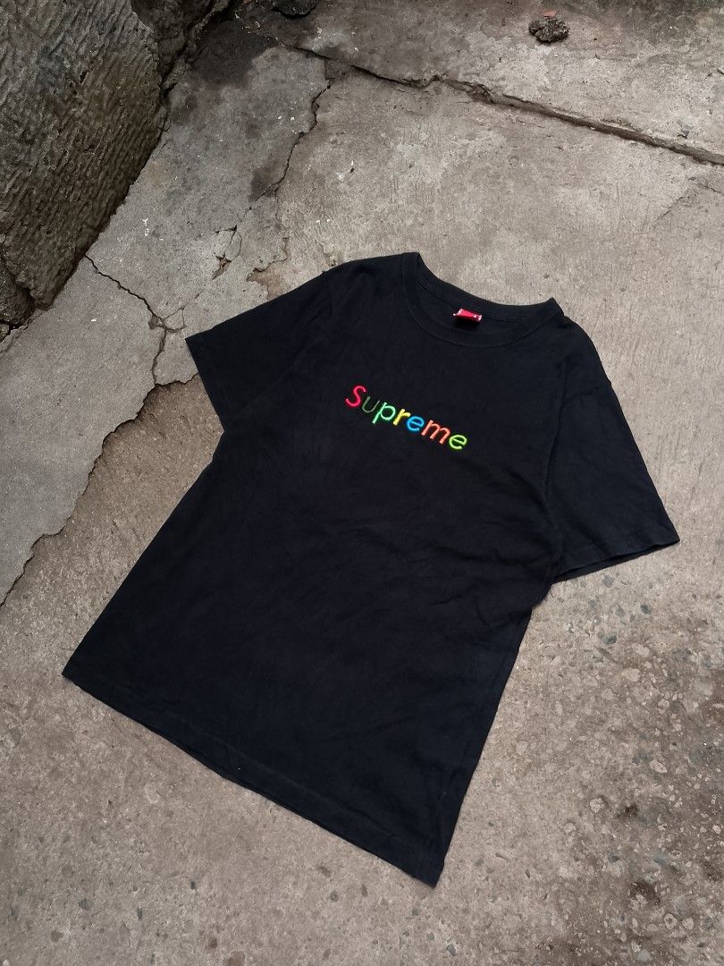 Supreme T-shirt Rainbow Logo Back Print (Category: Tshirts & Polo Shirts ) located in Muntinlupa City. Submitted by jo_thrift2 (Listing ID 1446335221, Image 3). Description: - Authentic Supreme T-shirt - Iconic rainbow logo on the front - Unique graphic print with text and images on the back - Excellent pre-loved condition, no significant flaws - Perfect for any streetwear enthusiast.