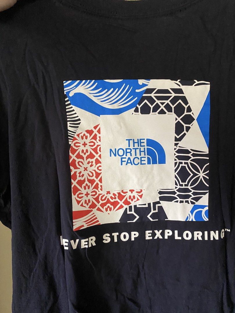 The North Face T-shirt Size L (Category: Tshirts & Polo Shirts ) located in Paranaque City. Submitted by helloooooopoo (Listing ID 1446222895, Image 2). Description: - Brand: The North Face - Color: Navy Blue - Size: Women's L - Design: Classic logo on front left chest, large 'Never Stop Exploring' graphic with logo on back - Origin: Made in El Salvador dm for questions .