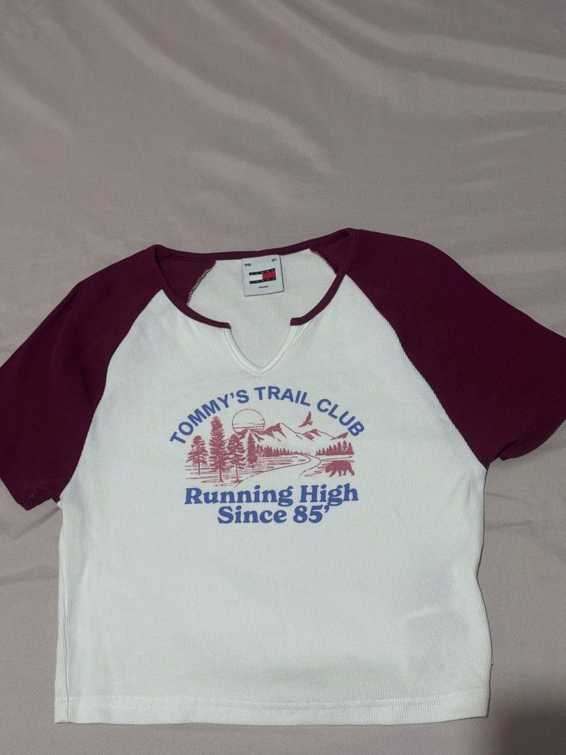 Tommy Jeans Graphic T-shirt (Category: Others Tops) located in Marikina City. Submitted by rozes22 (Listing ID 1446236734, Image 1). Description: - Brand: Tommy Jeans - Color: White and Maroon - Style: Raglan sleeve t-shirt - Texture: Ribbed - Size: Tagged Small (S) - Can fit small to medium.