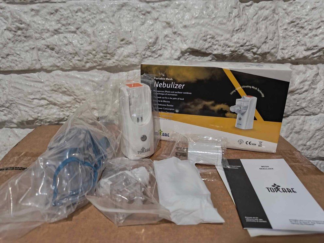 TOPCARE Portable Mesh Nebulizer (Category: Medical Supplies & Tools) located in Manila. Submitted by rosel2001 (Listing ID 1446176877, Image 2). Description: - Portable mesh nebulizer - Uses vibrating mesh technology - Comes with mask and accessories - Compact and easy to use - Ideal for on-the-go relief.