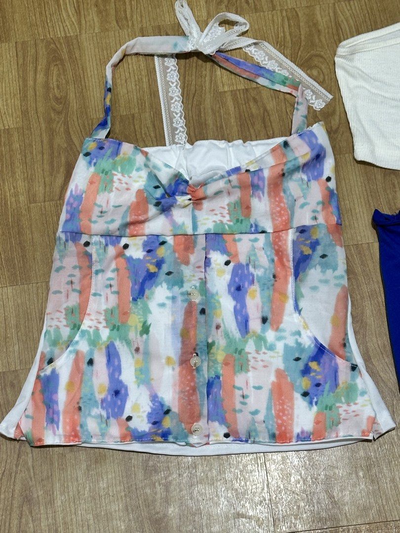 Tops Bundle (Category: Sets or Coordinates) located in Antipolo. Submitted by soshops (Listing ID 1446327521, Image 2). Description: - Bundle includes 3 tops. - Colorful halter neck top with button details. - White ribbed one-shoulder crop top from Zara. - Royal blue tube top. - Fits SMALL .