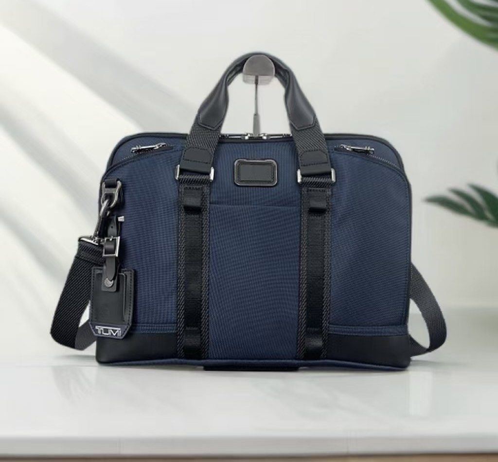 Tumi Alpha Bravo Academy Compact Laptop Bag (Category: Briefcases) located in Manila. Submitted by bagmaniaph (Listing ID 1446211176, Image 1). Description: - Navy blue Tumi briefcase - Made with durable nylon and leather accents - Features a detachable shoulder strap - Ample interior space for work essentials - Smooth-gliding zippers - Clean exterior and interior condition - Ideal for daily commutes and business trips.