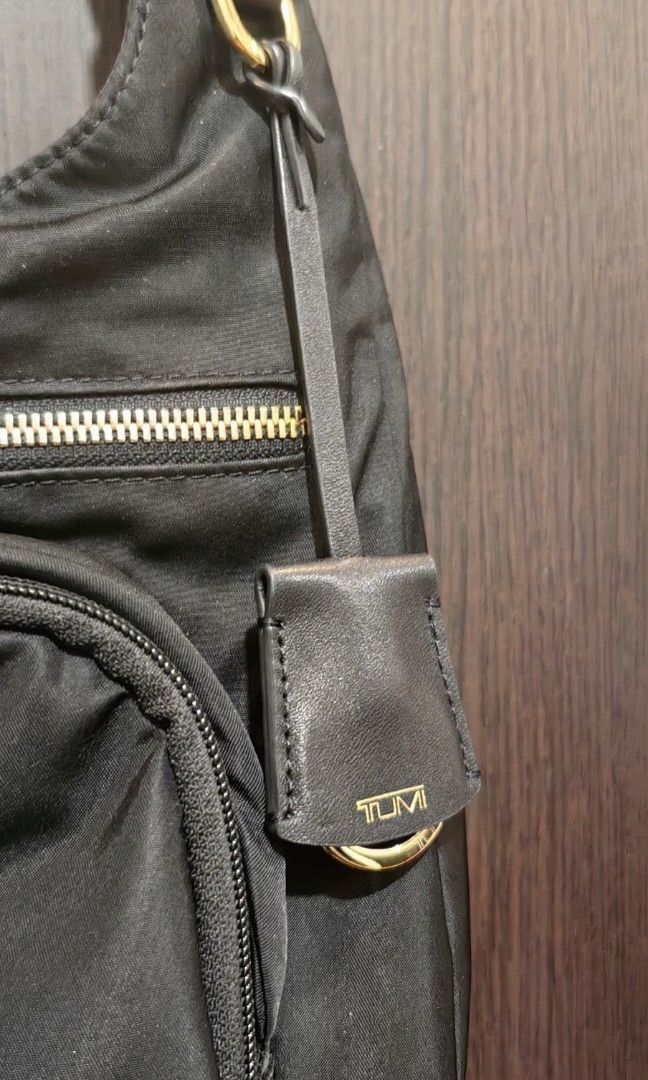 Tumi Sutton Crossbody Nylon Black (Category: Luxury Bags & Wallets) located in San Pedro. Submitted by chichingscloset (Listing ID 1446281039, Image 3). Description: Preloved but well loved No issues, No flaws Original with card and receipts Bought in USA🇺🇸 12.75" x 12.5" x 3 With 3 pockets inside With 1pocket at the back of bag With zipper pocket infront Loc: San Pedro, Laguna.