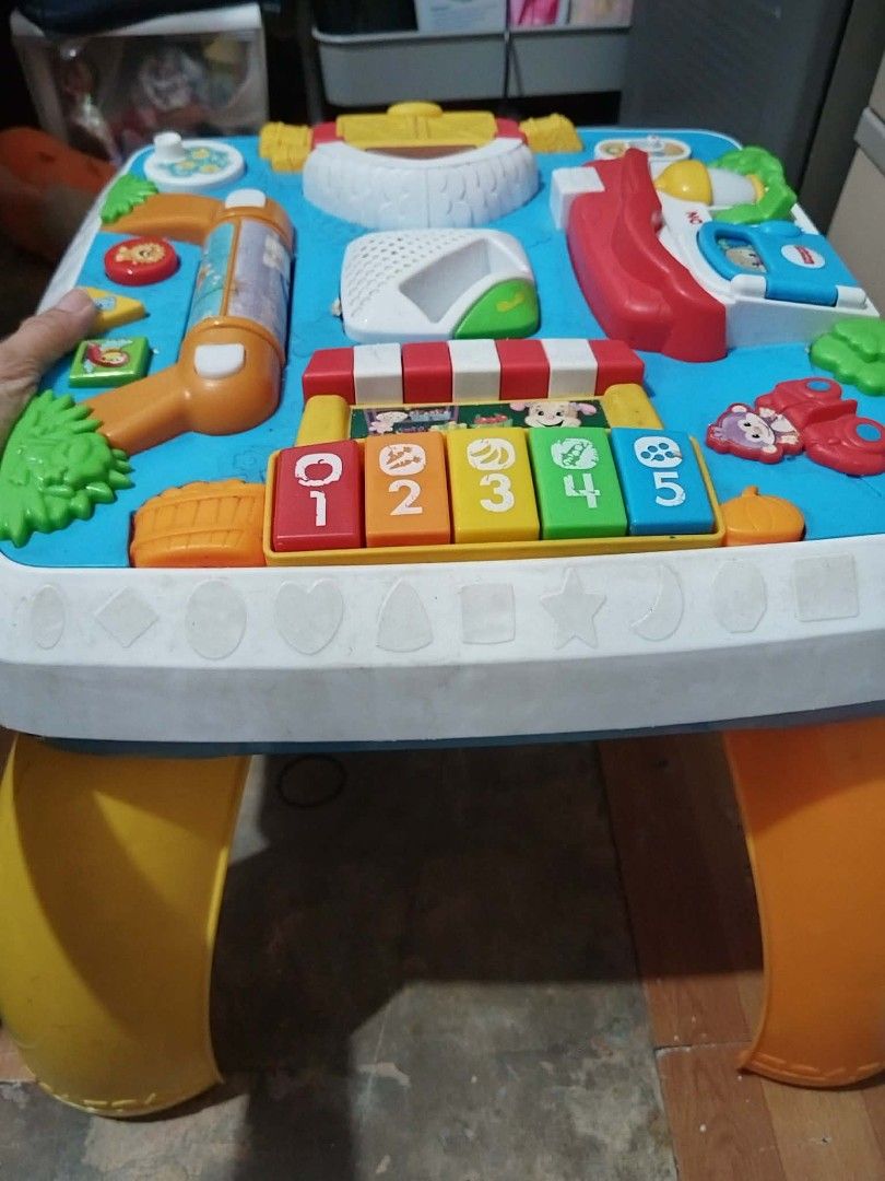 VTech Smart Wheels Activity Table (Category: Infant Playtime) located in Quezon City. Submitted by ctraex (Listing ID 1446198849, Image 3). Description: - Interactive activity table for little ones - Lots of buttons, sounds, and engaging toys - Includes a piano with numbers 1-5 - Features a fun little slide - Detachable legs for versatile floor play - Helps develop motor skills and learning.