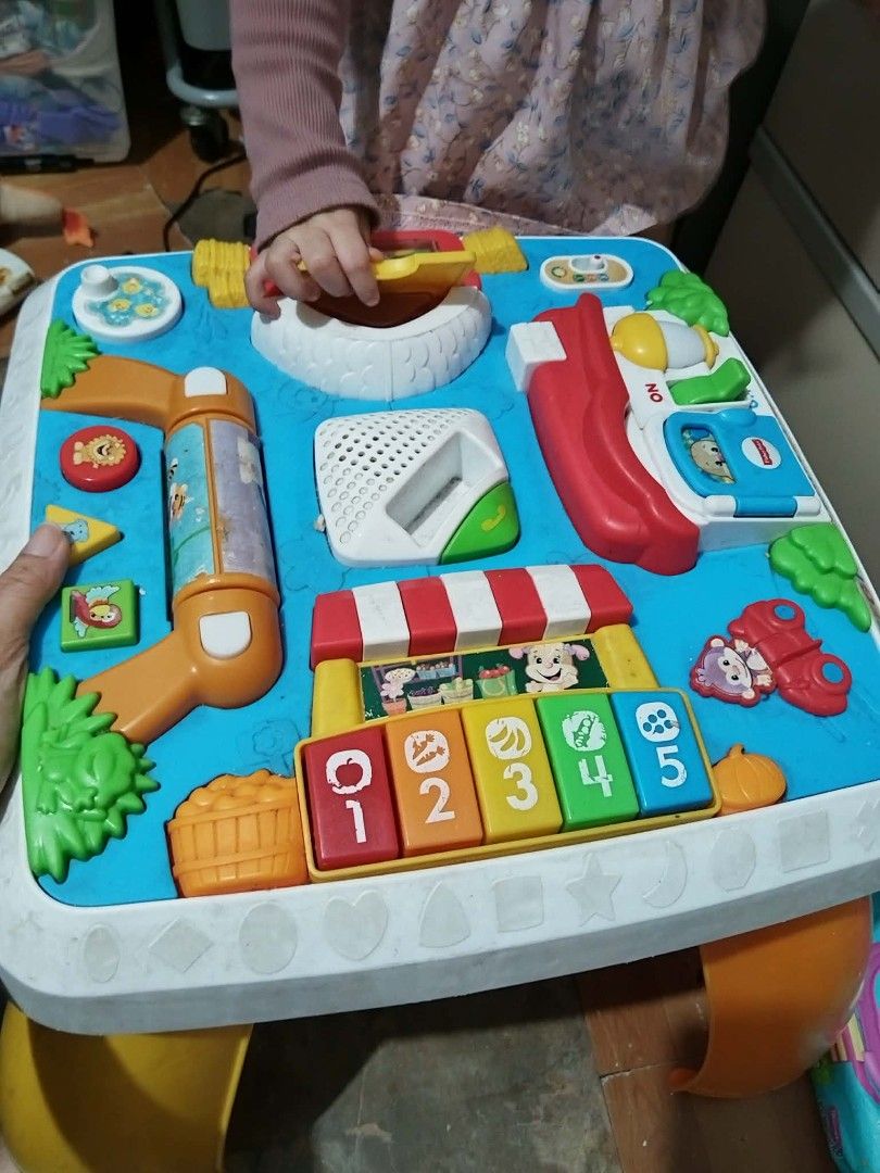 VTech Smart Wheels Activity Table (Category: Infant Playtime) located in Quezon City. Submitted by ctraex (Listing ID 1446198849, Image 2). Description: - Interactive activity table for little ones - Lots of buttons, sounds, and engaging toys - Includes a piano with numbers 1-5 - Features a fun little slide - Detachable legs for versatile floor play - Helps develop motor skills and learning.