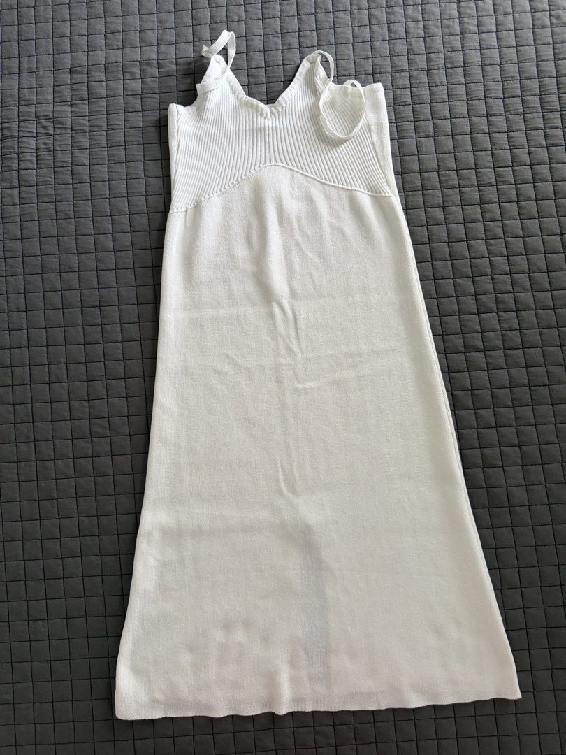 White Knit Midi Dress with Spaghetti Straps (Category: Dresses) located in Makati City. Submitted by triftedandbranded (Listing ID 1446194843, Image 2). Description: - White knit midi dress - Ribbed bodice - Flowy skirt - Spaghetti straps - Simple and chic design - Versatile for layering or wearing on its own.