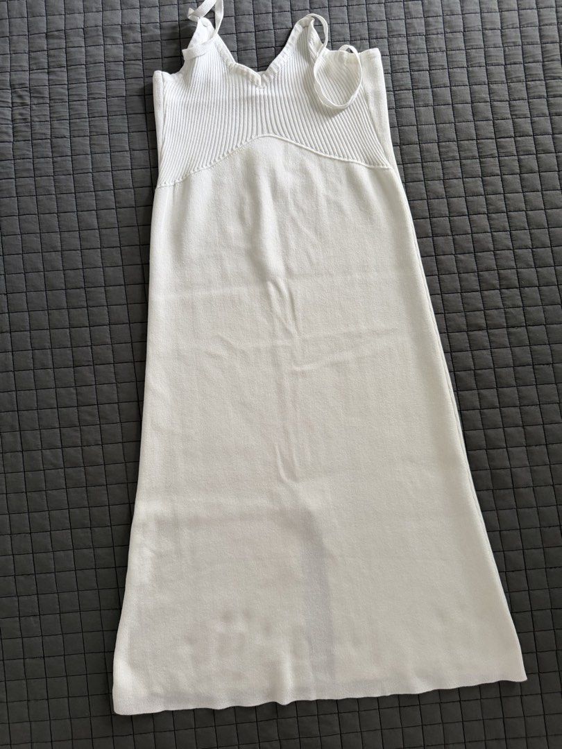 White Knit Midi Dress with Spaghetti Straps (Category: Dresses) located in Makati City. Submitted by triftedandbranded (Listing ID 1446194843, Image 1). Description: - White knit midi dress - Ribbed bodice - Flowy skirt - Spaghetti straps - Simple and chic design - Versatile for layering or wearing on its own.