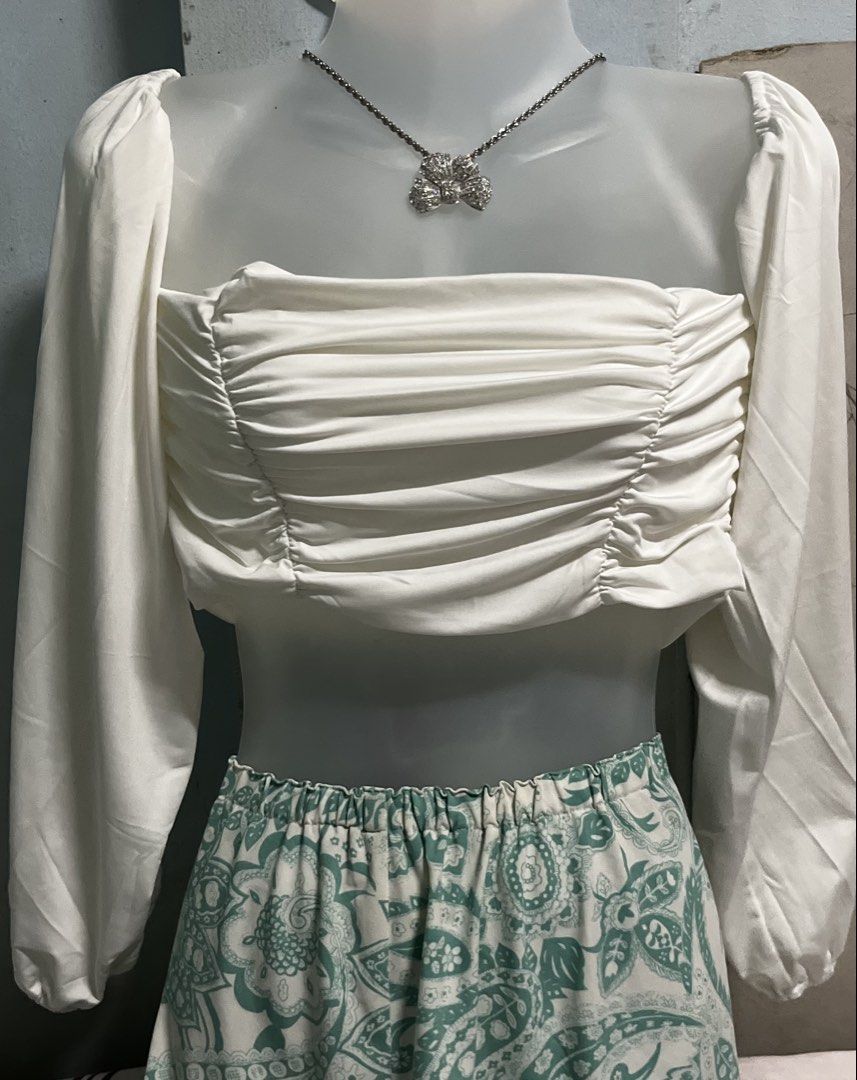 White Ruched off shoulder Long Sleeve Crop Top (Category: Blouses) located in Tabuk. Submitted by zenwolf-1867 (Listing ID 1446266761, Image 1). Description: - White long sleeve crop top - Ruched detailing - off shoulder - Smooth, comfortable fabric - Versatile: great for casual days or nights out - Pairs perfectly with high-waisted bottoms.