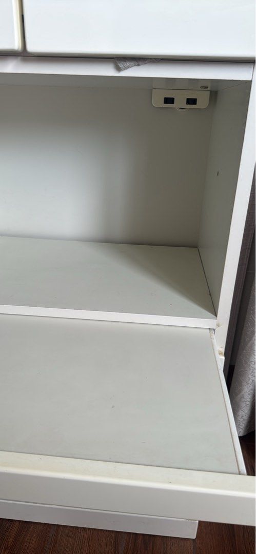White Storage Cabinet with Shelves and Doors (Category: Shelves, Cabinets & Racks) located in Mandaluyong City. Submitted by saroosss (Listing ID 1446165414, Image 3). Description: - glossy off White storage cabinet - Features 4 doors: 2 on top, 2 on bottom, one pullout drawer, 2 sockets - Includes a convenient middle open - sturdy made of quality wood, japan quality - Ideal for decluttering and organizing your home Delivery handled and shouldere