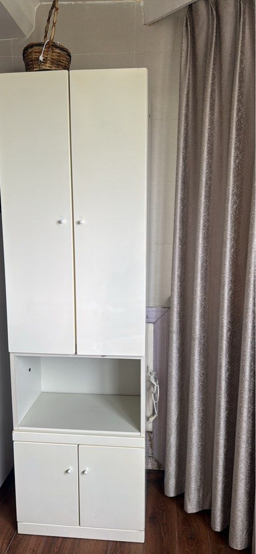 White Storage Cabinet with Shelves and Doors (Category: Shelves, Cabinets & Racks) located in Mandaluyong City. Submitted by saroosss (Listing ID 1446165414, Image 1). Description: - glossy off White storage cabinet - Features 4 doors: 2 on top, 2 on bottom, one pullout drawer, 2 sockets - Includes a convenient middle open - sturdy made of quality wood, japan quality - Ideal for decluttering and organizing your home Delivery handled and shouldere