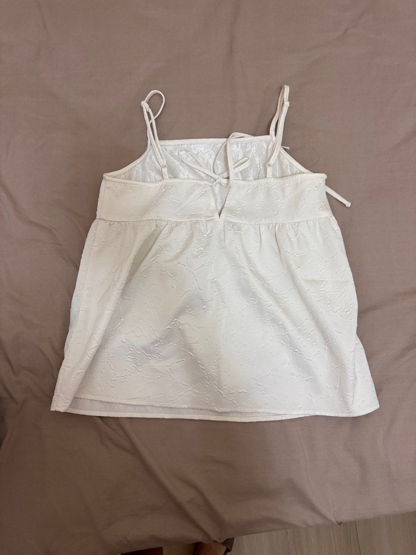 white thrifted cami top (Category: Sleeveless) located in Manila. Submitted by rianbfr (Listing ID 1446296909, Image 2). Description: thrifted from japan second street, no size or tags, used thrice, no tears, stains.