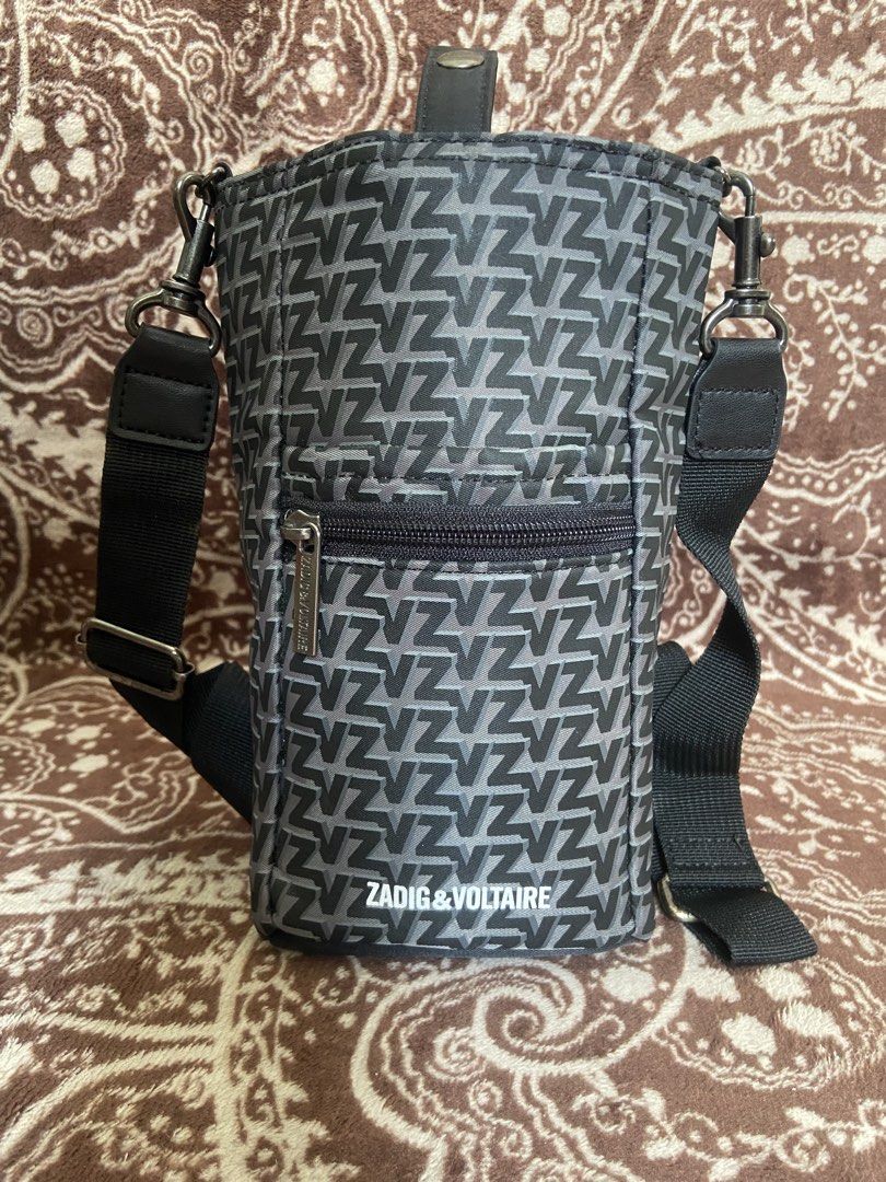 Zadig & Voltaire Monogram Crossbody Bag (Category: Luxury Bags & Wallets) located in Pili. Submitted by rgthriftflip29 (Listing ID 1446181956, Image 1). Description: - Zadig & Voltaire crossbody bag - All-over 'Z' monogram print - Zippered front pocket - Main compartment with snap closure - Adjustable strap - Ideal for on-the-go essentials - Durable material with reinforced base L:5” W:4” D:9” ☑️OVERALL EXCELLENT CONDI ❌ISSUE: MINIMAL SCRATCH ON 