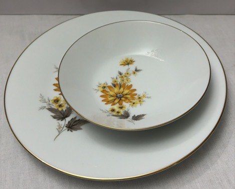2-piece Noritake "Calista" Dinner set (Category: Dinnerware & Cutlery) located in Quezon City. Submitted by lopezlavi (Listing ID 1446422692, Image 2). Description: Includes a standard Dinner Plate, which has a smooth, flat porcelain background allows the large aster daisy and long leaf spray to branch out extensively toward the gold rim. The bowl has a golden floral arrangement climbs elegantly up the curved interior wall of the bowl. Available: