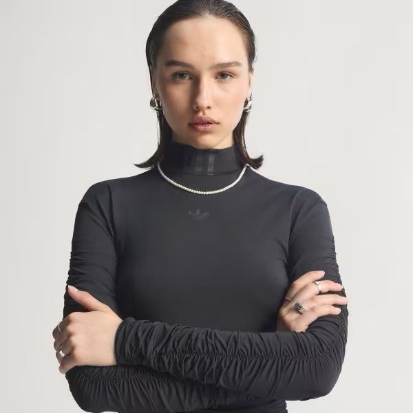 Adidas Ruched Long Sleeve Turtleneck Top Black (Category: Longsleeves) located in Kuala Lumpur. Submitted by supsupwater (Listing ID 1446517081, Image 3). Description: - Black Adidas long sleeve top size S - Retail 249 > 180 - Ruched detailing on sleeves and body for a flattering fit - Subtle Adidas logo on the chest - Versatile: great for layering or wearing on its own - Very stylish and modern design.
