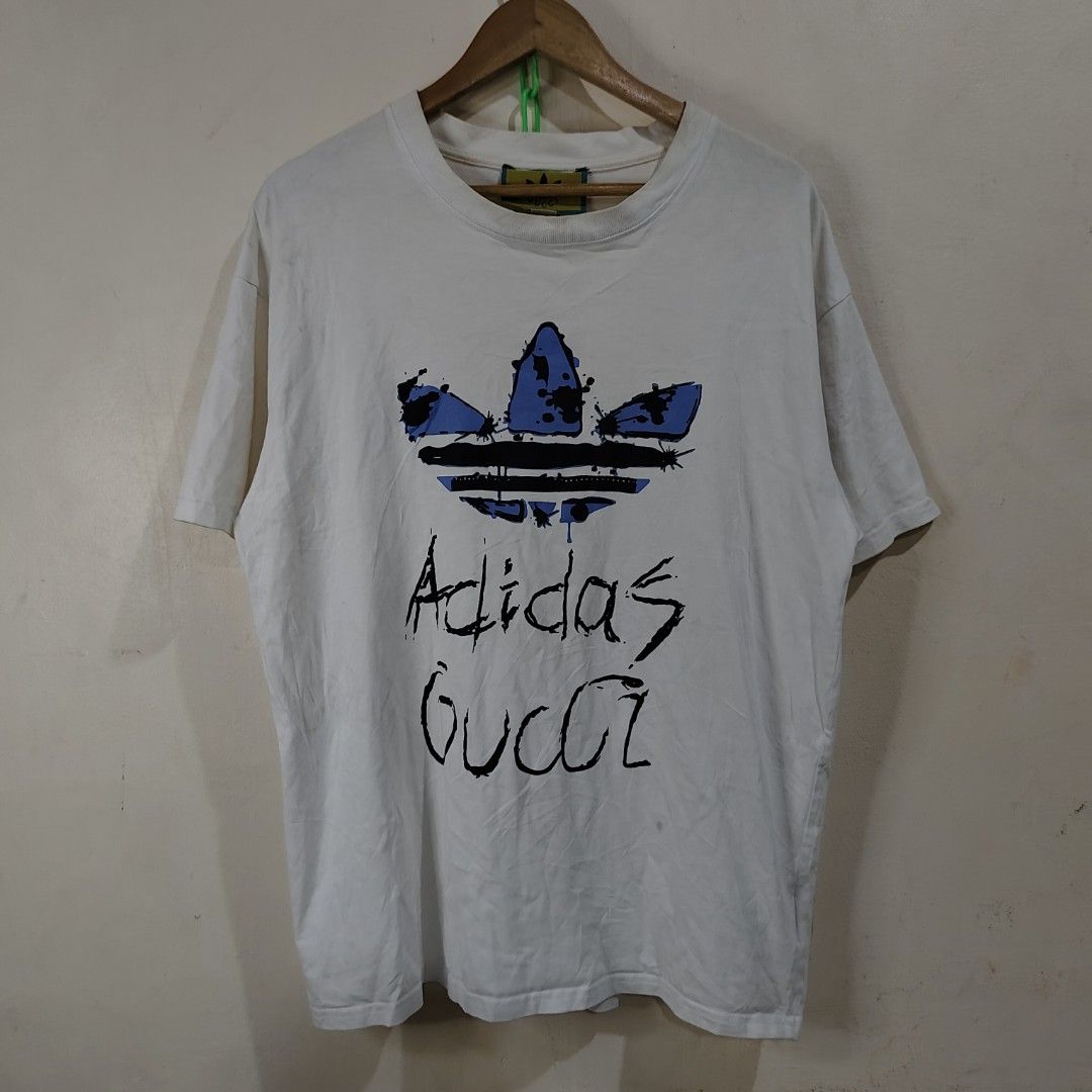 ADIDAS X GUCCI SHIRT (Category: Luxury Apparel) located in Bulacan. Submitted by markkiethrift2023 (Listing ID 1446368816, Image 1). Description: ADIDAS X GUCCI EXCELLENT CONDITION DIMES: 21 x 28.5 NEED WASH.