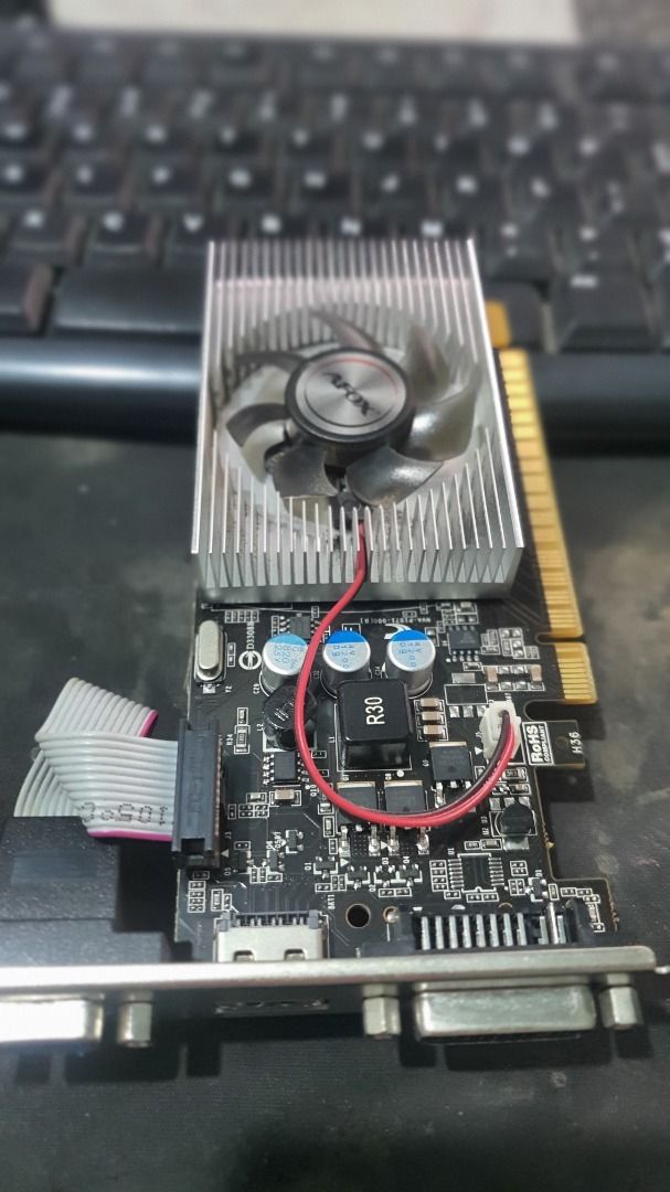 AFOX GT730 2GB DDR3 Graphics Card (Category: Computer Parts) located in Caloocan City. Submitted by grandwolf-f664b0 (Listing ID 1446407998, Image 2). Description: - AFOX GT730 Graphics Card - 2GB DDR3 Memory - Outputs: DVI, VGA, HDMI - Ideal for PC upgrades or budget builds - Tested and confirmed working - Selling due to system upgrade.