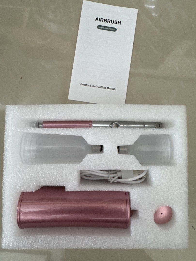 Airbrush Kit with Compressor and Accessories (Category: Craft Supplies & Tools) located in Quezon City. Submitted by sellinglowerthanlow (Listing ID 1446405359, Image 1). Description: - Portable airbrush kit - Includes airbrush gun, compressor, 2 bottles, and USB charging cable - Metallic pink compressor - Pink and silver airbrush gun - Comes with instruction manual.
