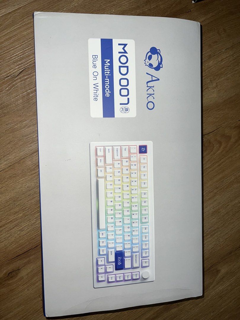 Akko MOD007 Multi-mode Keyboard Blue On White (Category: Computer Keyboard) located in Quezon City. Submitted by qojovaaa26240 (Listing ID 1446384972, Image 1). Description: - Akko MOD007 Keyboard - Color: Blue On White - Multi-mode connectivity - Includes coiled USB-C cable - Comes with extra keycaps - Convenient side knob - Ideal for gaming and typing.