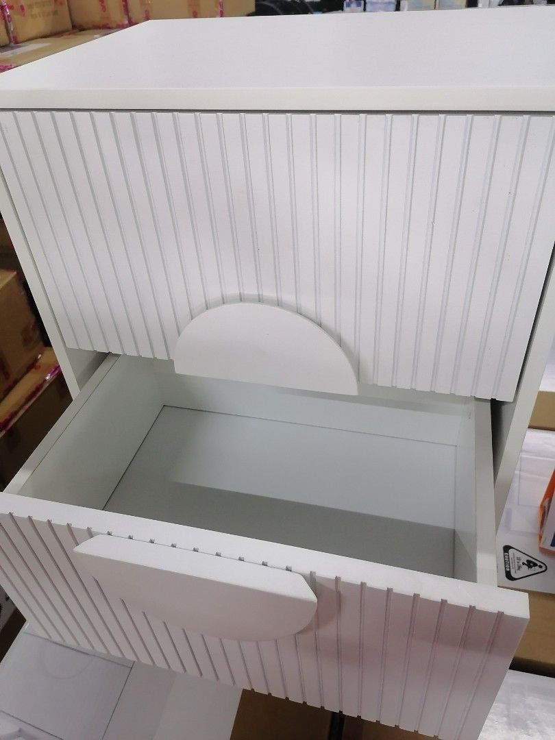 Anko Ribbed Bedside Table White (Category: Tables & Sets) located in Muntinlupa City. Submitted by fast_bryantorrentefernand (Listing ID 1446389398, Image 2). Description: - COLOR = BLACK AND WHITE - Chic white bedside table - Unique ribbed texture and circular drawer fronts - Two spacious drawers for storage - Modern metal frame - Easy assembly with included instructions - Dimensions: Approx. 55cm (H) x 40cm (W) x 30cm (D).