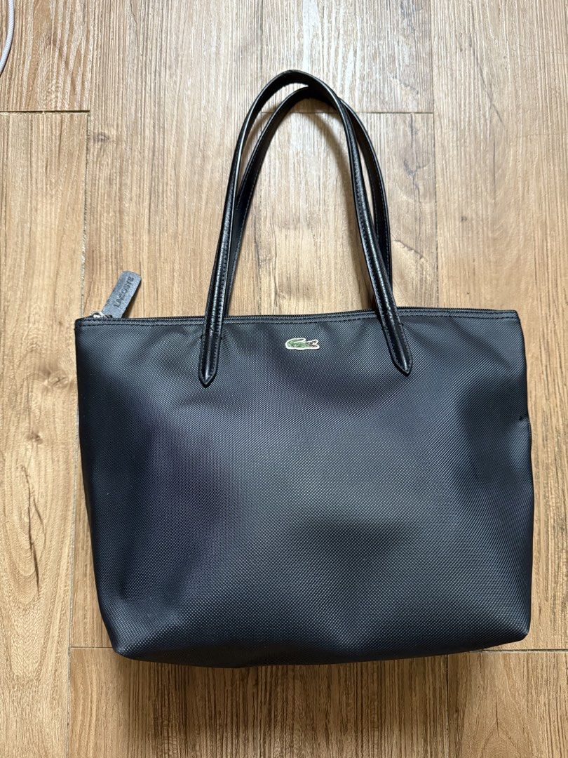 AUTHENTIC Lacoste Black Tote Bag (Category: Tote Bags) located in Manila. Submitted by threshold01 (Listing ID 1446394508, Image 2). Description: Small size Rfs: have to many bags Issue: needs cleaning nastock lang sa cabinet, and signs of usage, please check photos for reference..