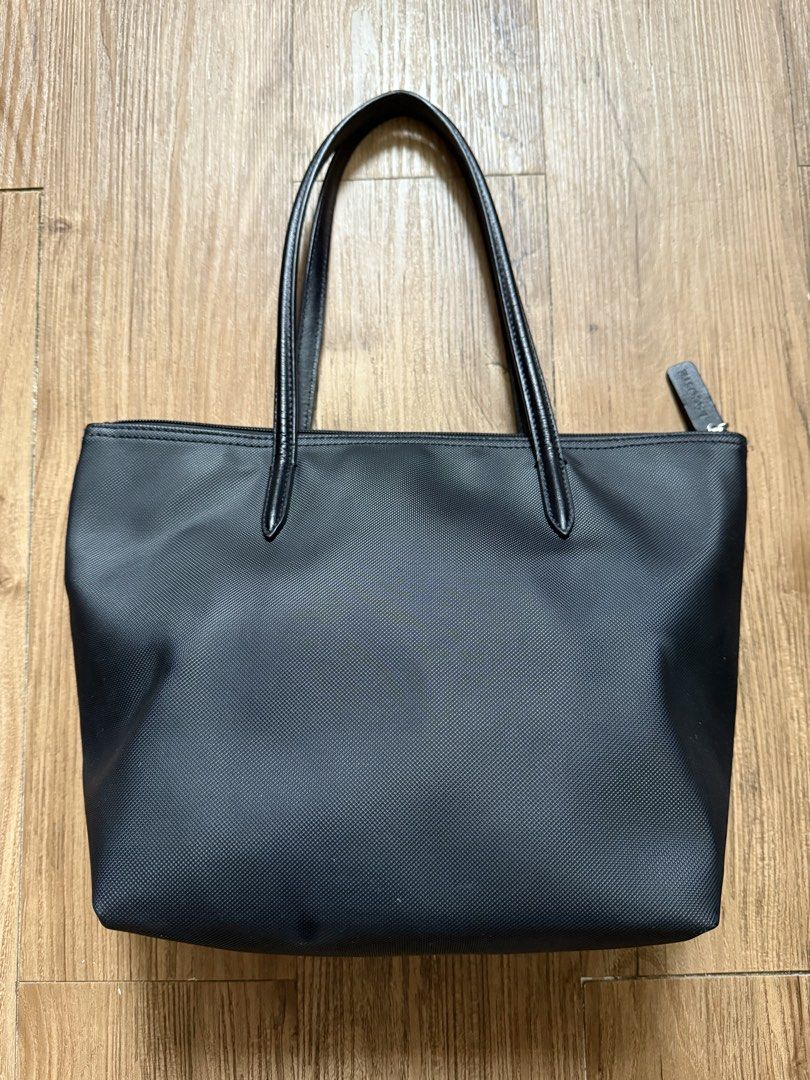 AUTHENTIC Lacoste Black Tote Bag (Category: Tote Bags) located in Manila. Submitted by threshold01 (Listing ID 1446394508, Image 3). Description: Small size Rfs: have to many bags Issue: needs cleaning nastock lang sa cabinet, and signs of usage, please check photos for reference..