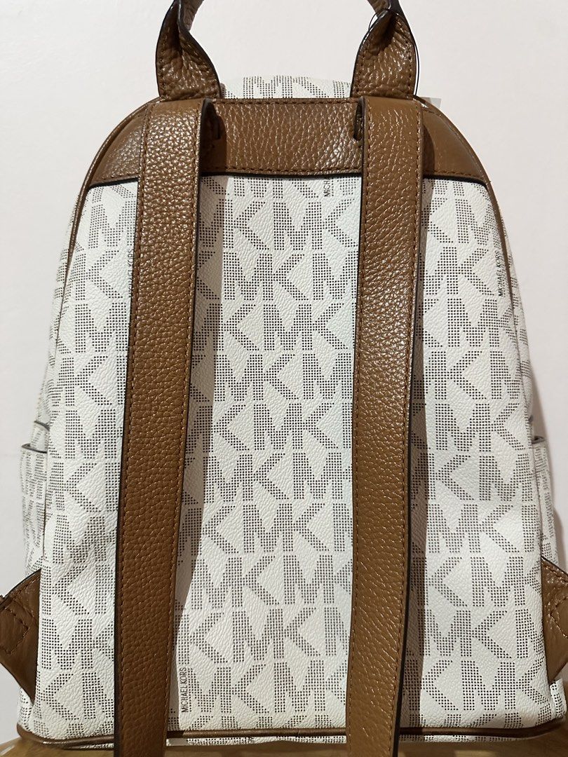 Authentic! Michael Kors Signature Logo Backpack (Category: Luxury Bags & Wallets) located in Manila. Submitted by jslnd (Listing ID 1446378261, Image 2). Description: Like new condition, no flaws Ready to ship.