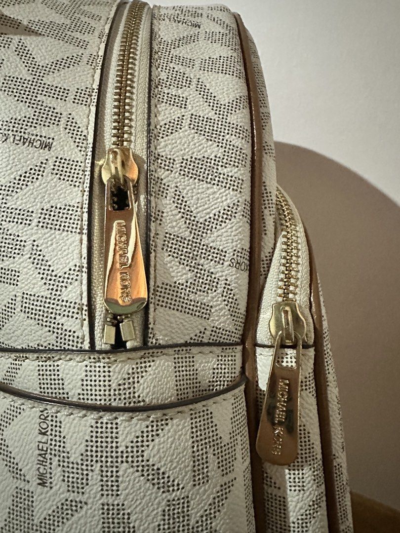 Authentic! Michael Kors Signature Logo Backpack (Category: Luxury Bags & Wallets) located in Manila. Submitted by jslnd (Listing ID 1446378261, Image 3). Description: Like new condition, no flaws Ready to ship.