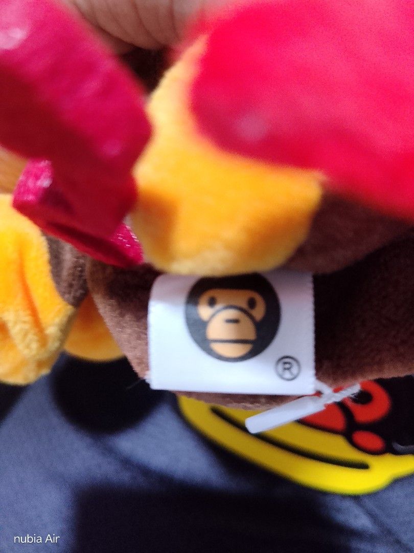 Bape Baby Milo Store Devil Monkey Plush Toy (Category: Plushies & Soft Toys) located in Quezon City. Submitted by nothingn1c3 (Listing ID 1446527864, Image 3). Description: - Cute devil monkey plush from Baby Milo Store. - Features brown fur with red wings and horns. - Yellow face and orange feet. - Original Baby Milo tag is attached. - Ideal for Baby Milo collectors and fans. - A fun and unique collectible item..