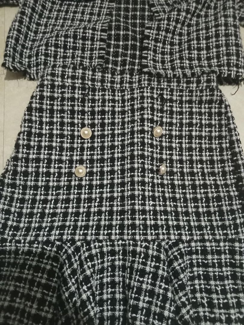 Black & White Plaid Tweed Jacket and Skirt Set (Category: Sets or Coordinates) located in Cavite. Submitted by dmprelovedclothes (Listing ID 1446366367, Image 2). Description: - Two-piece set: cropped jacket and ruffled hem skirt - Classic black and white plaid tweed pattern - Skirt features decorative pearl buttons on the front - Chic and classic style, perfect for dressing up Used onced (can pass as brandnew) 9/10 condition *Color may vary due 