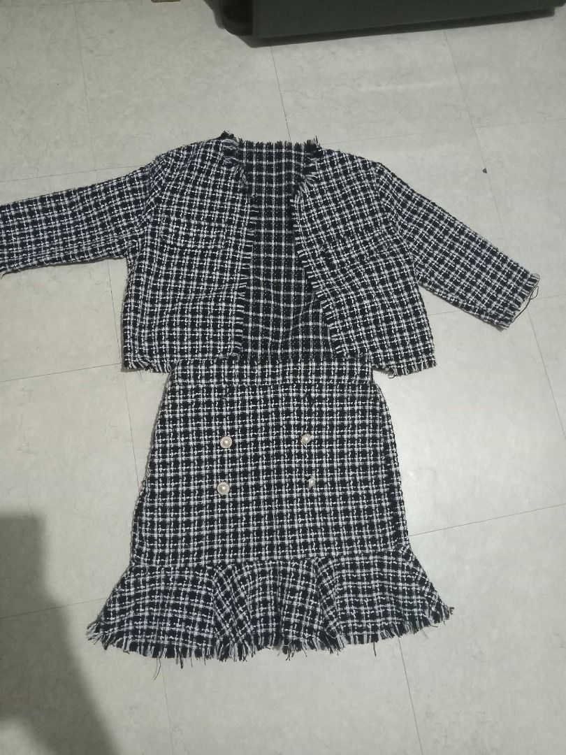 Black & White Plaid Tweed Jacket and Skirt Set (Category: Sets or Coordinates) located in Cavite. Submitted by dmprelovedclothes (Listing ID 1446366367, Image 1). Description: - Two-piece set: cropped jacket and ruffled hem skirt - Classic black and white plaid tweed pattern - Skirt features decorative pearl buttons on the front - Chic and classic style, perfect for dressing up Used onced (can pass as brandnew) 9/10 condition *Color may vary due 