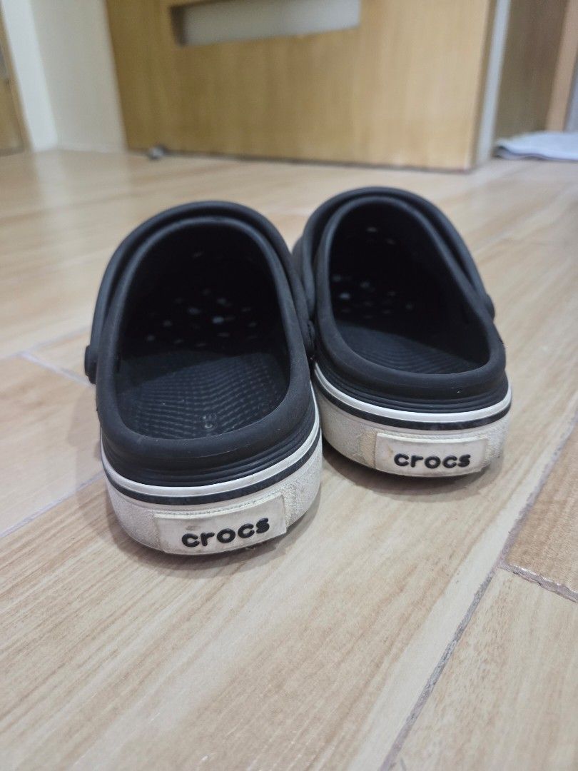 Black Crocs with Pokemon Jibbitz (Category: Slippers and slides) located in Manila. Submitted by mannaala (Listing ID 1446397594, Image 2). Description: - Black Crocs with unique Pokemon jibbitz - Includes Pokeball and circular Pokemon jibbitz - Additional lightning bolt jibbitz included - White trim around the sole is slightly dirty - Still in good, wearable condition with lots of life left Size: W6, M4.