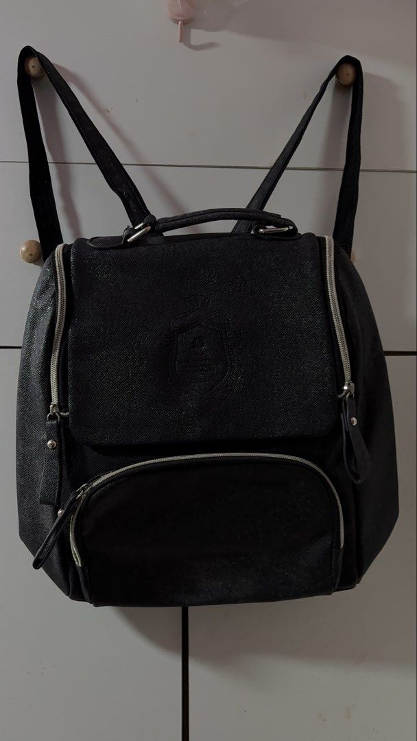 Black Faux Leather Backpack with Zipper Pockets (Category: Backpacks) located in Davao. Submitted by sammyang123 (Listing ID 1446451980, Image 1). Description: - Chic black backpack with a textured faux leather finish. 🎉🎉FREE SF‼️🚨 - Spacious main compartment for your essentials. - Convenient front zipper pocket for quick access. - Two additional side zipper pockets for extra storage. - Adjustable shoulder straps for a comfortable fit. - Sturd
