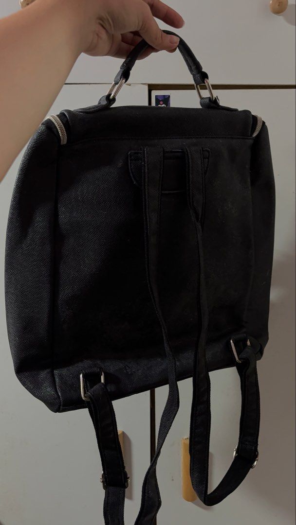 Black Faux Leather Backpack with Zipper Pockets (Category: Backpacks) located in Davao. Submitted by sammyang123 (Listing ID 1446451980, Image 2). Description: - Chic black backpack with a textured faux leather finish. 🎉🎉FREE SF‼️🚨 - Spacious main compartment for your essentials. - Convenient front zipper pocket for quick access. - Two additional side zipper pockets for extra storage. - Adjustable shoulder straps for a comfortable fit. - Sturd