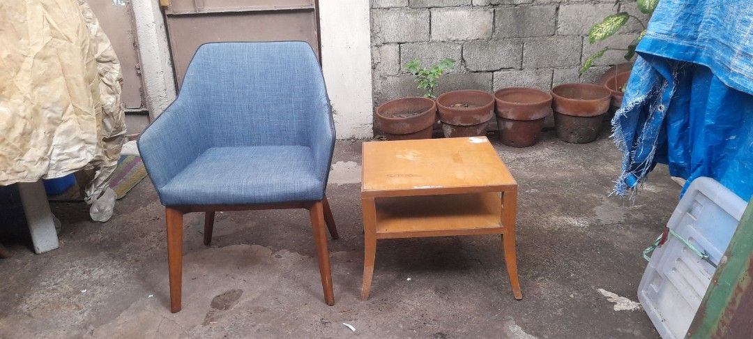 Blue accent chair with wooden side table (Category: Tables & Sets) located in Valenzuela. Submitted by newbear.425b6e (Listing ID 1446370183, Image 2). Description: - Comfy blue accent chair with modern design - Sturdy wooden legs - Includes matching wooden side table with shelf for storage - Ideal for reading nooks or small living spaces - Well-made and ready for its new home -surplus po sia ung chair medyo Natastas po, table po pa varnish nlng.