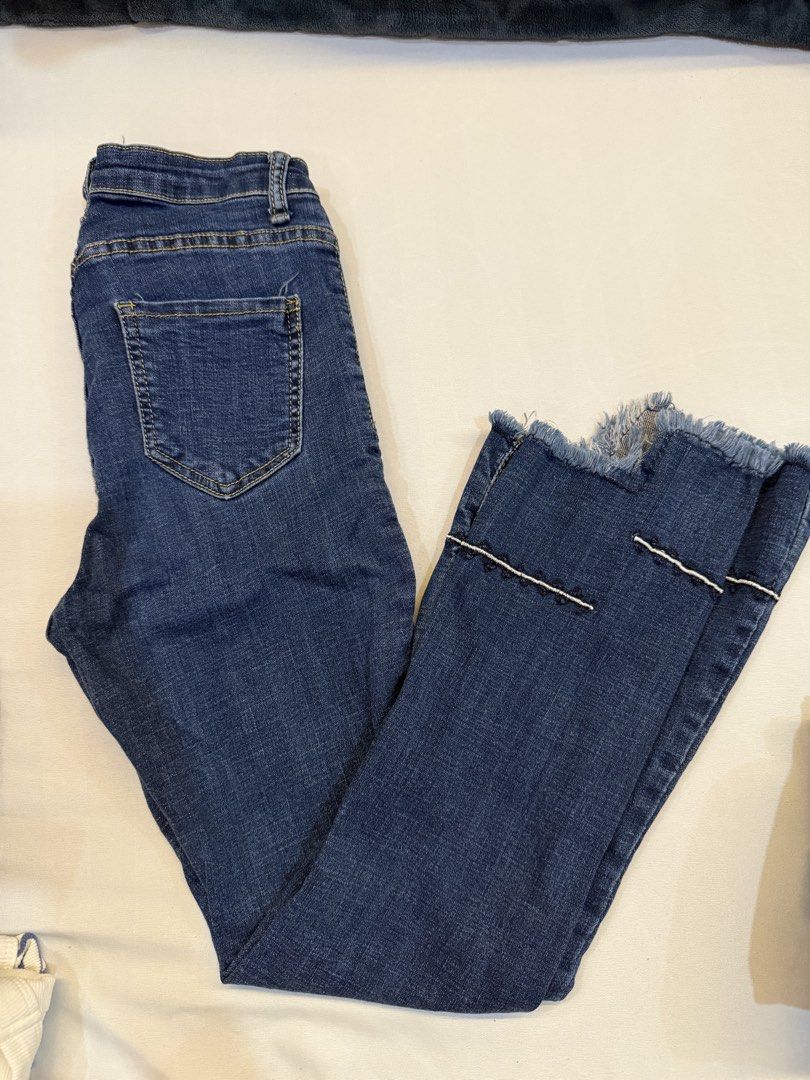 Blue Denim Jeans with Frayed Hem (Category: Jeans) located in Makati City. Submitted by herloqxury (Listing ID 1446392849, Image 1). Description: - Slim fit blue denim jeans - Frayed hem - Unique stitched detail on lower leg - Ideal for casual wear - Easy to pair with various tops and shoes.