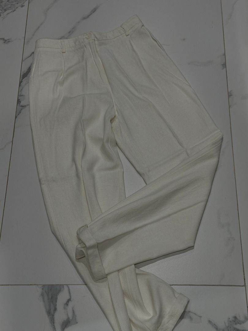 Brandy Melville Linen White Trousers (Category: Other Bottoms) located in Mandaluyong City. Submitted by kayechx (Listing ID 1446496136, Image 1). Description: - White Brandy Melville trousers - High-waisted fit - Pleated front detail - Classic straight leg - Button and zip closure - Two back pockets - Versatile for any occasion - price SLIGHTLY negotiable, but not by a lot huhu already selling cheap since i need closet space asap will give 10% d