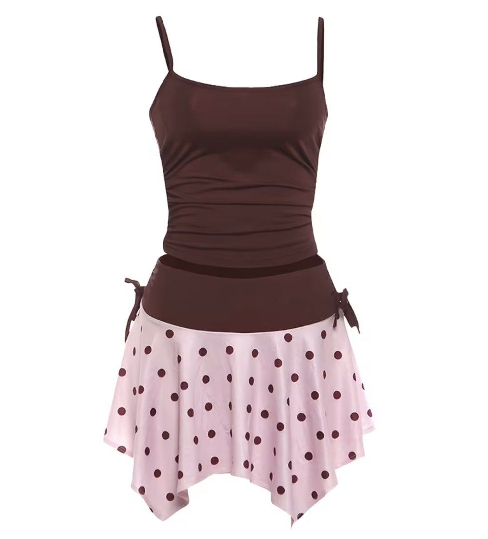 Brown & Pink Polka Dot Skirt Set (Category: Sets or Coordinates) located in Malabon City. Submitted by spamwithegg (Listing ID 1446416357, Image 2). Description: - Cute brown tankini top - Matching pink polka dot skirt - Skirt features a ruffled hem - Adjustable tie details on the sides of the skirt - Ideal for beach or pool - Comfortable and stylish for summer fun.