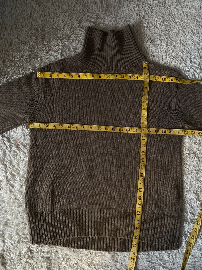 Brown Knit Turtleneck Sweater From JAPAN (Category: Longsleeves) located in Cabuyao City. Submitted by getvintage (Listing ID 1446404109, Image 3). Description: - Cozy brown knit turtleneck sweater - Features ribbed cuffs and hem - Versatile for layering or standalone wear - Measurements: Pit to pit approx. 19 inches, Length approx. 25 inches - Ideal for cooler weather.