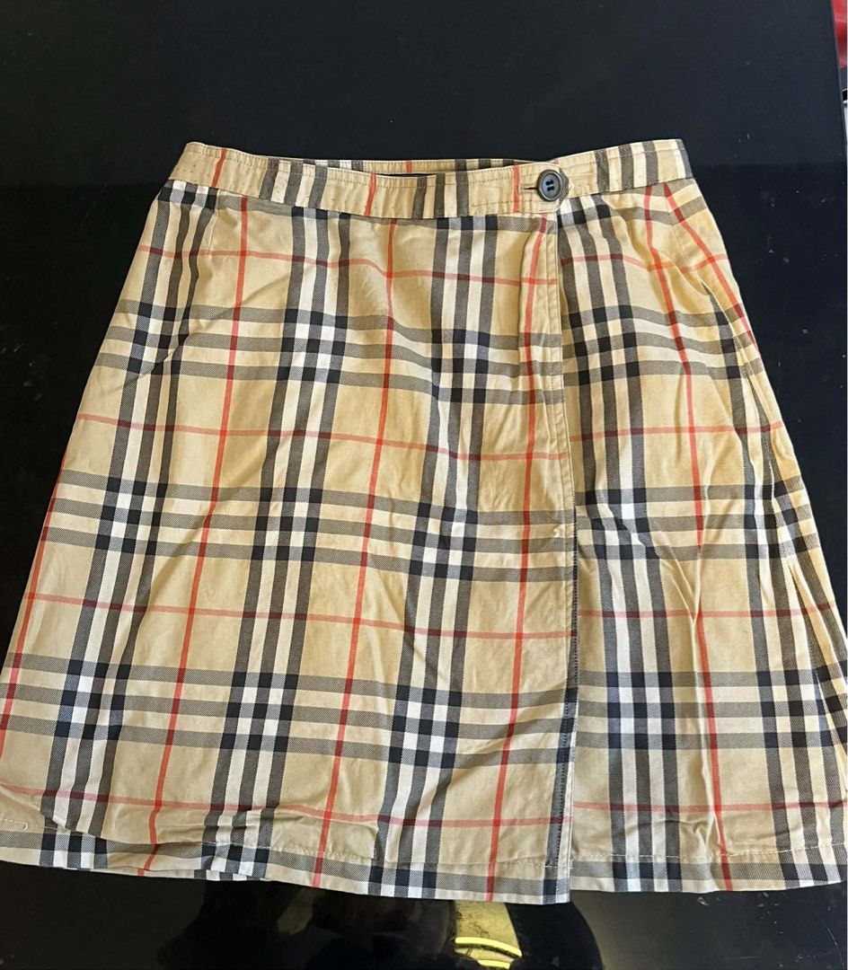 Burberrys Nova Check Wrap Skirt Size L (Category: Luxury Apparel) located in Meycauayan. Submitted by venelyngum56325 (Listing ID 1446389343, Image 1). Description: - Classic Burberrys Nova Check Wrap Skirt - Size: Large (L) - Features the iconic Burberry check pattern - Side button closure for a secure fit - Versatile for casual or smart casual outfits - A timeless addition to your wardrobe.